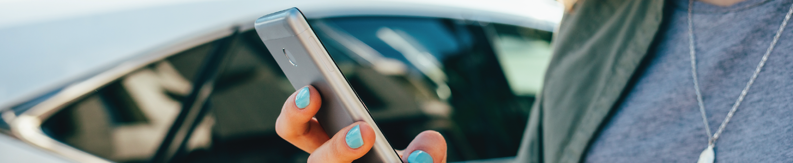 A woman holding a mobile phone.