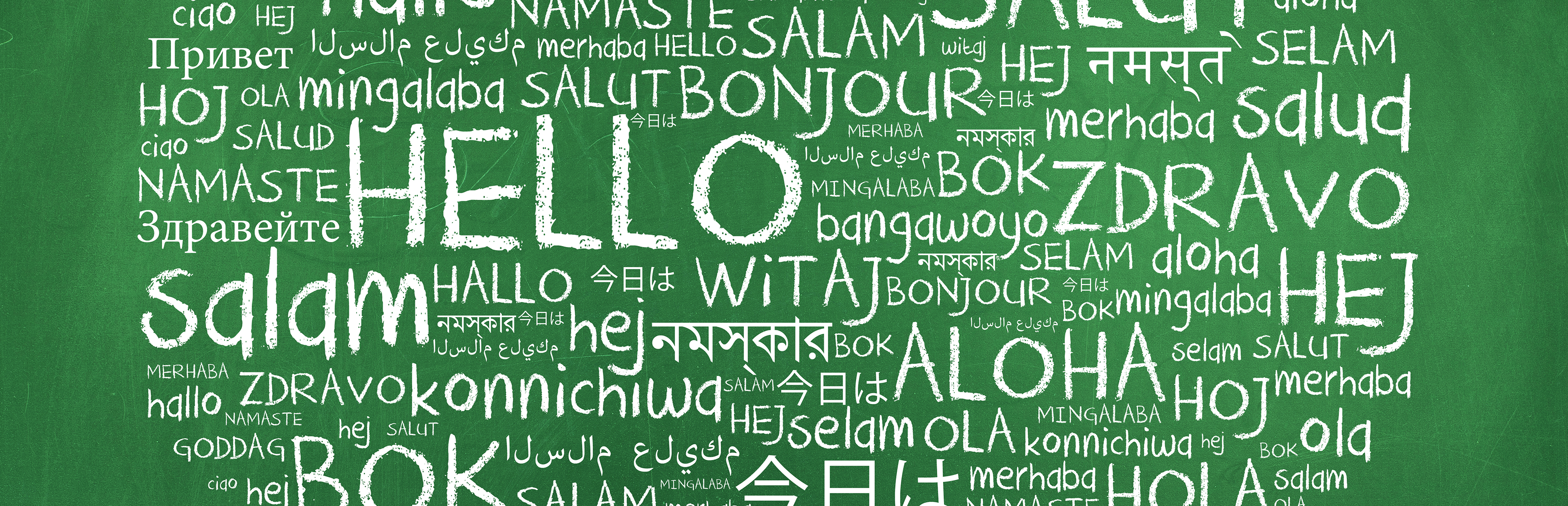 Chalkboard with Hello in different languages written on it