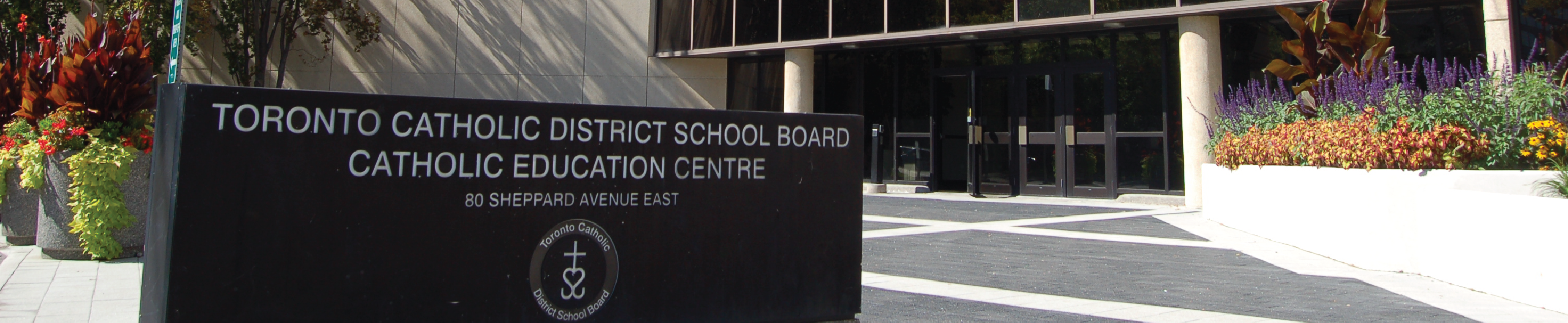 Building sign in front of building for Toronto Catholic District School Board's Catholic Education Centre.