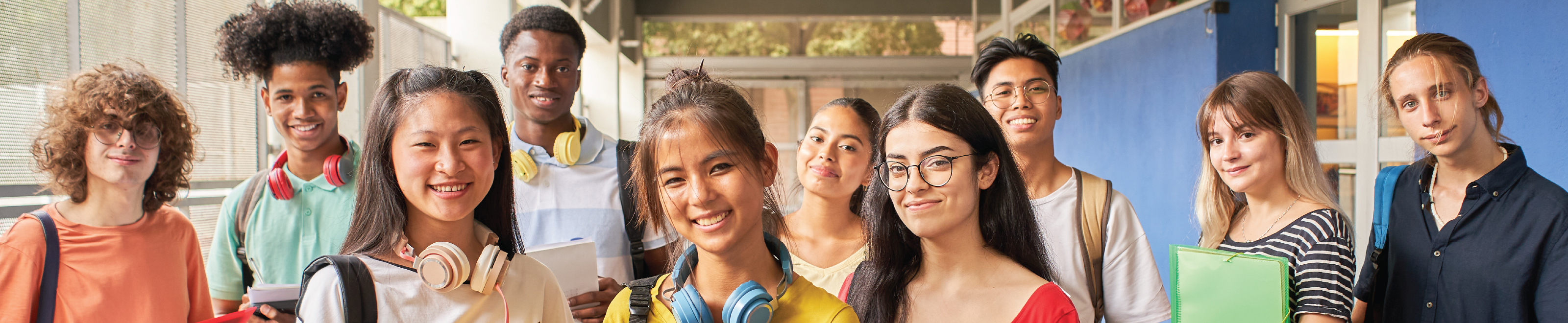 A group of international students smiling at the camera.