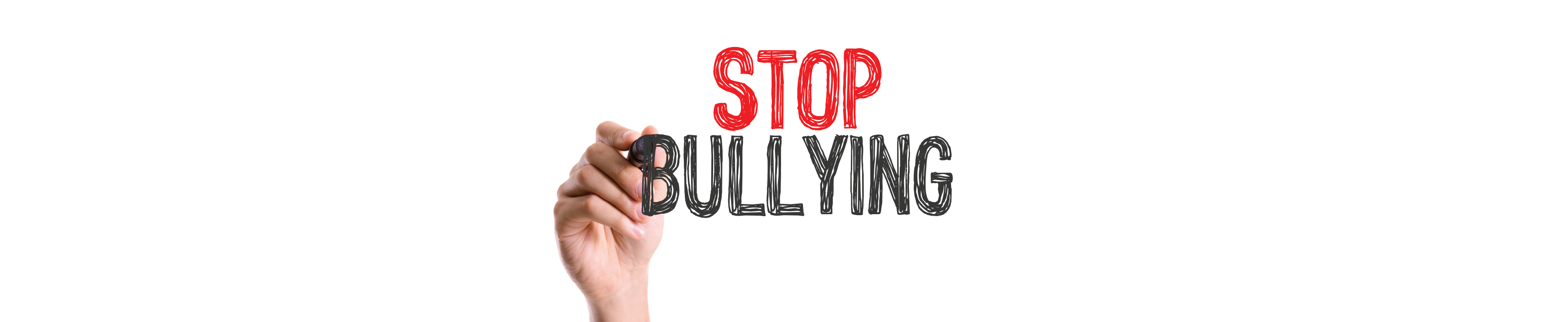 An image of a hand writing on a whiteboard - Stop Bullying