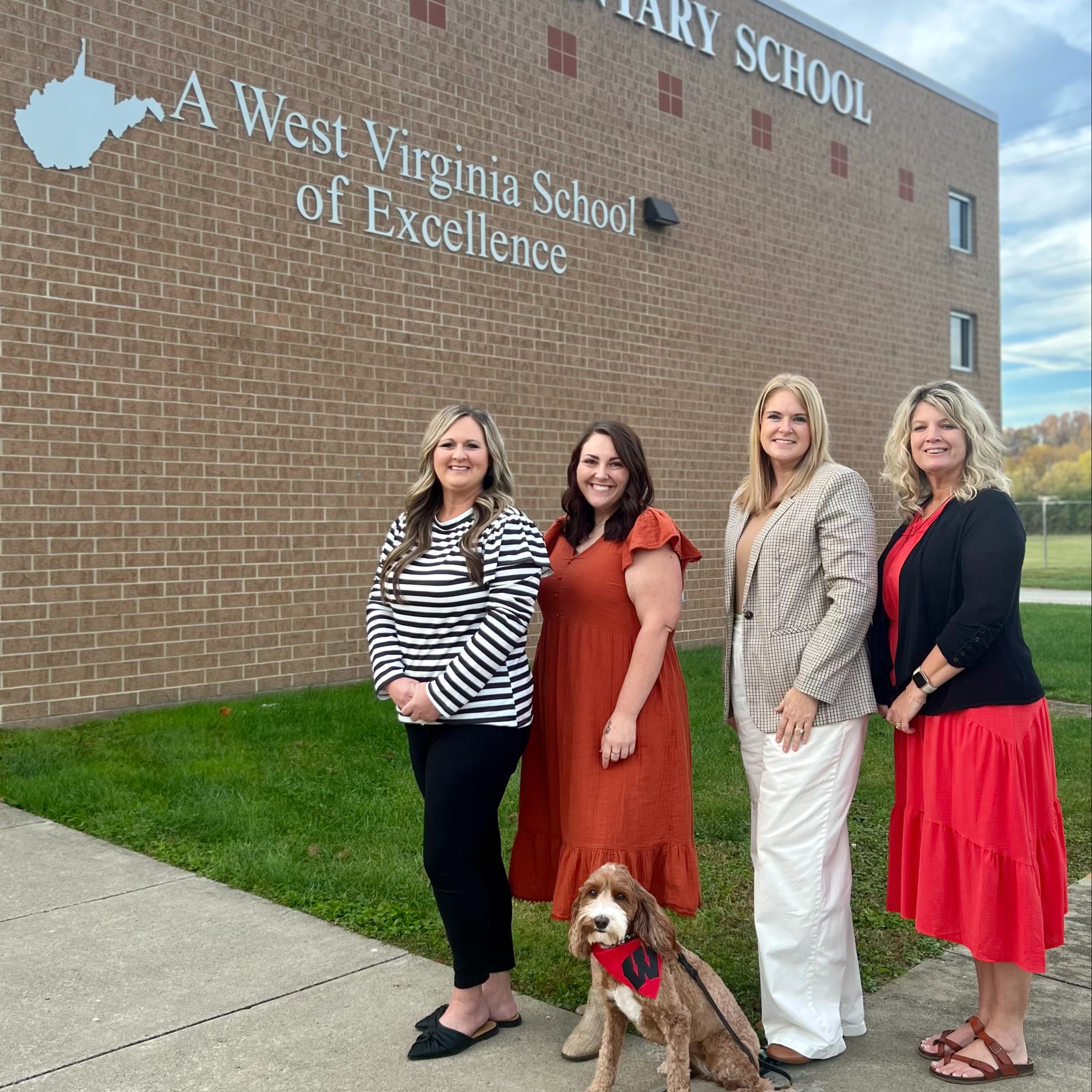 Picture of principal, assistant principal, and counselors, along with therapy dog, of Wayne Elementary School.
