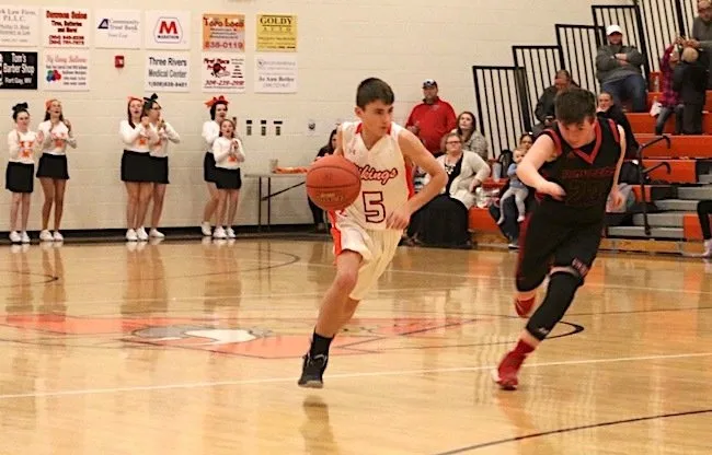 Student playing basketball