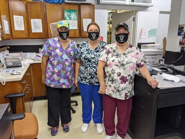 Three teachers wearing masks