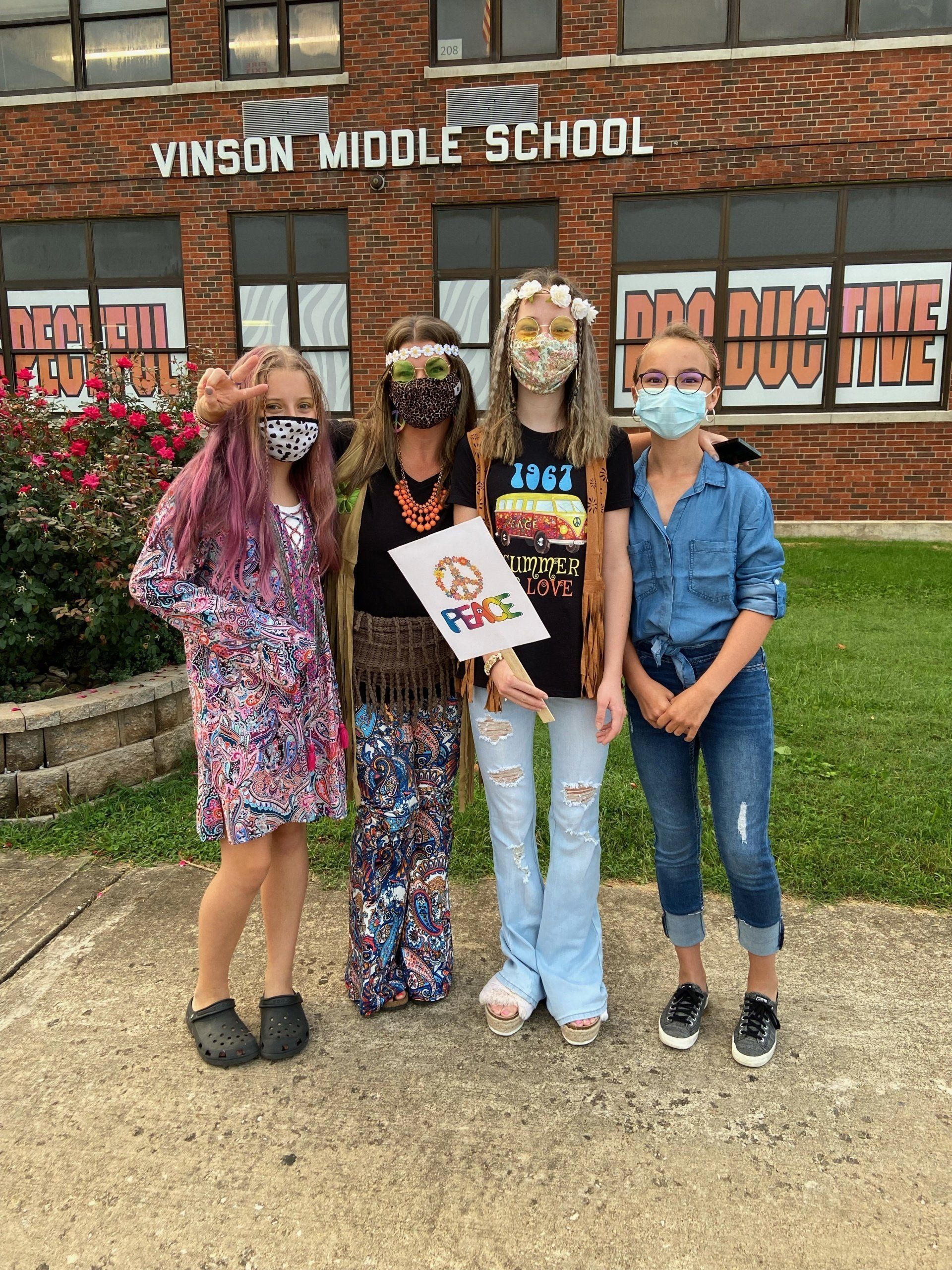 Students dressed up outside the school entrance