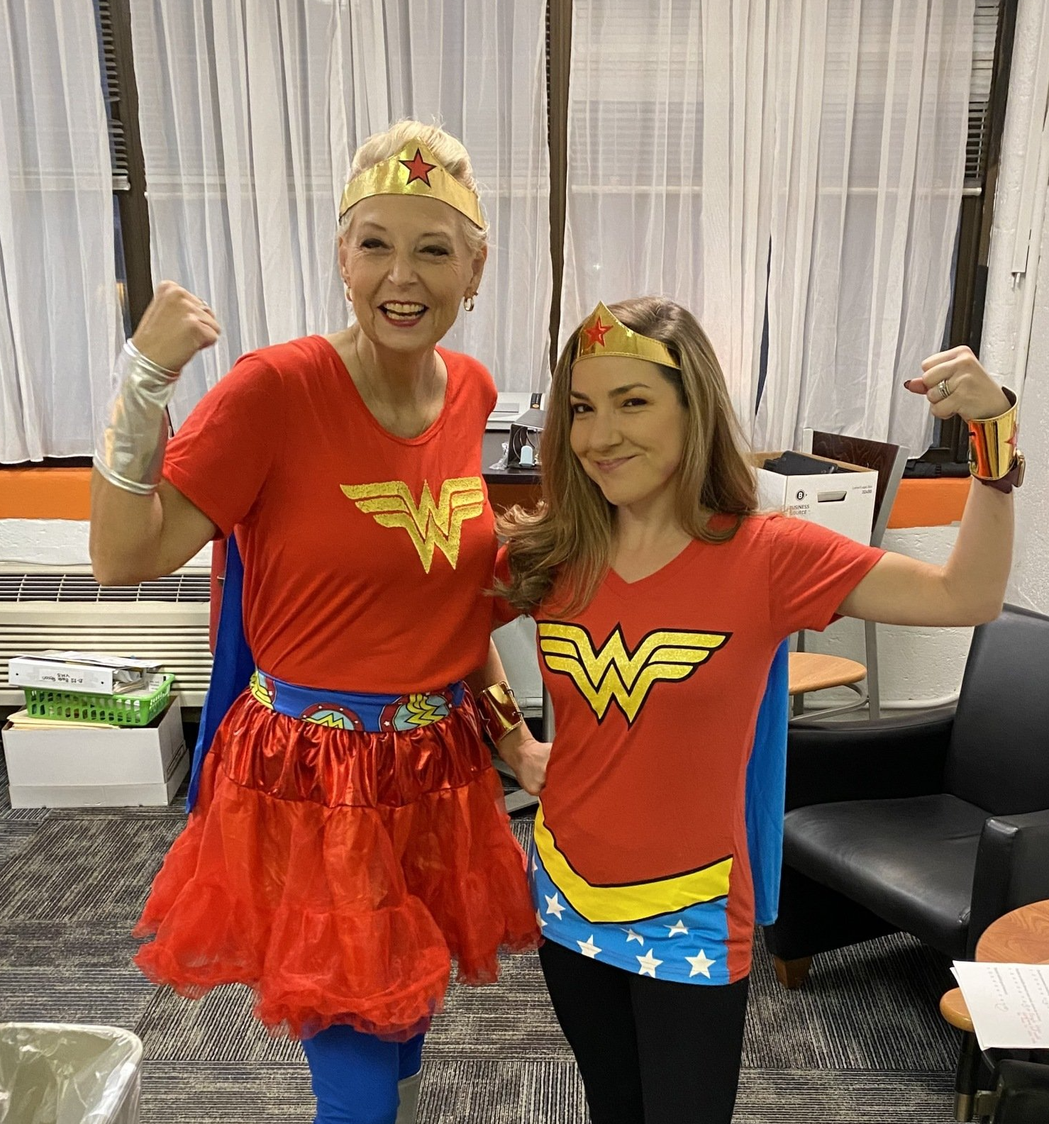 Two ladies dressed up as wonder women