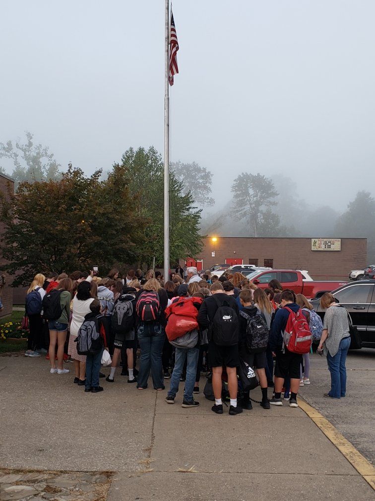 Students by a flagpole