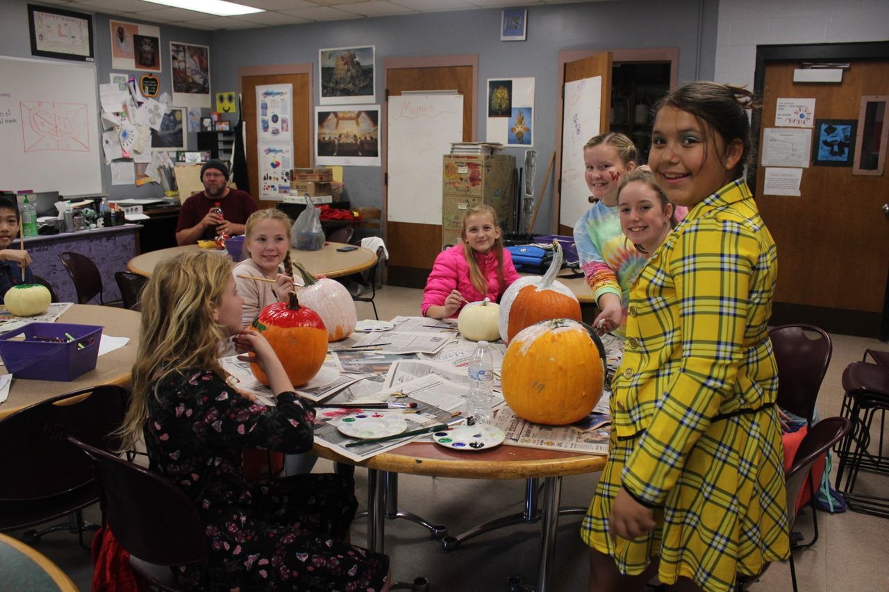 Students working with pumpkins