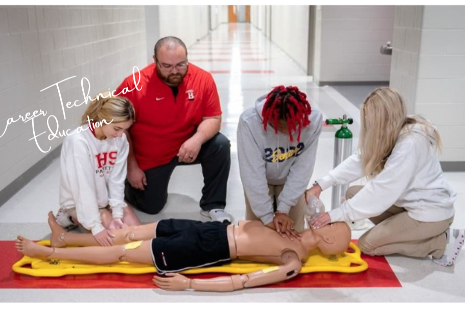 students performing CPR