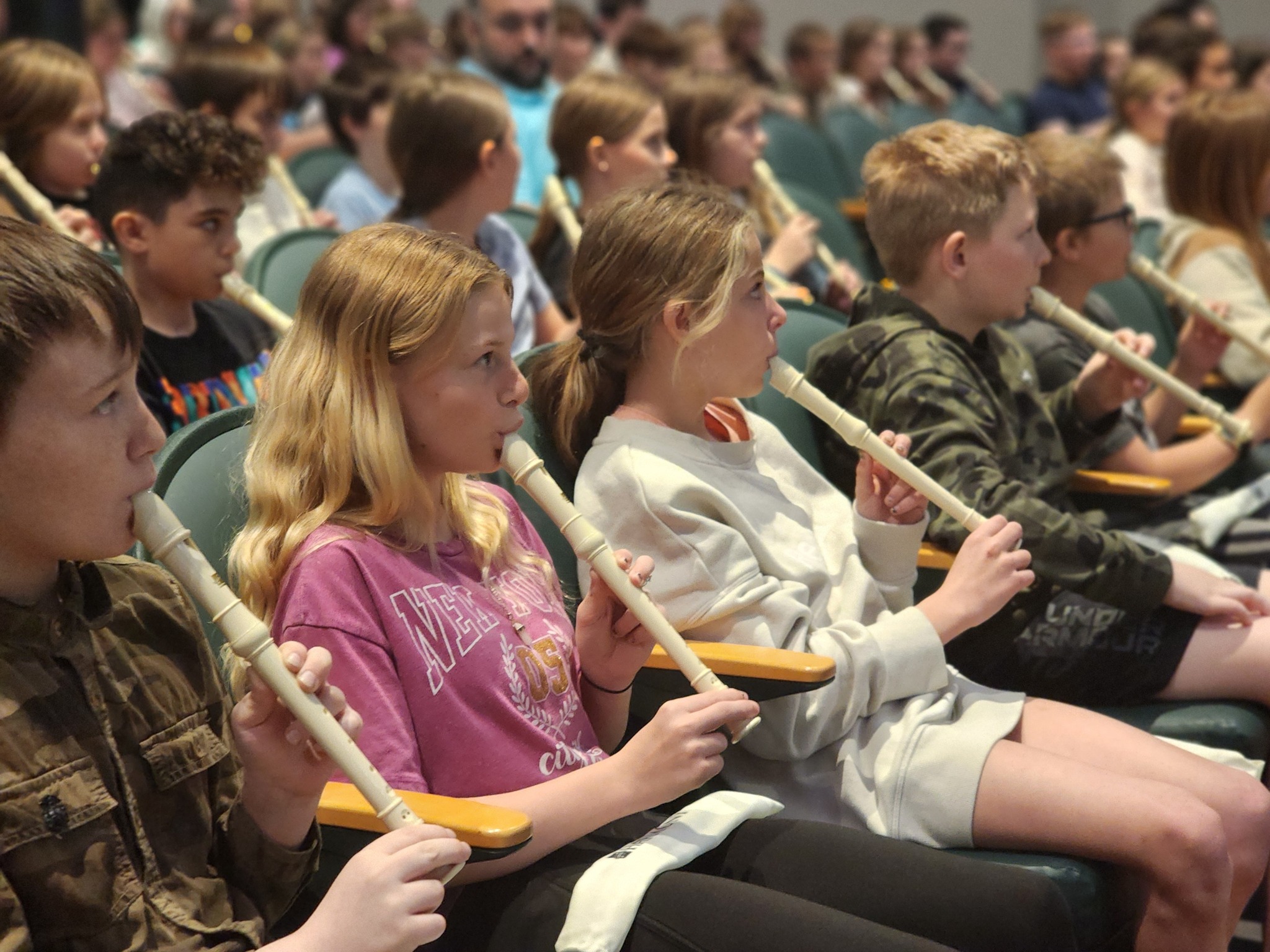 Students play recorders at Carnegie Hall Link Up Partnership Concert