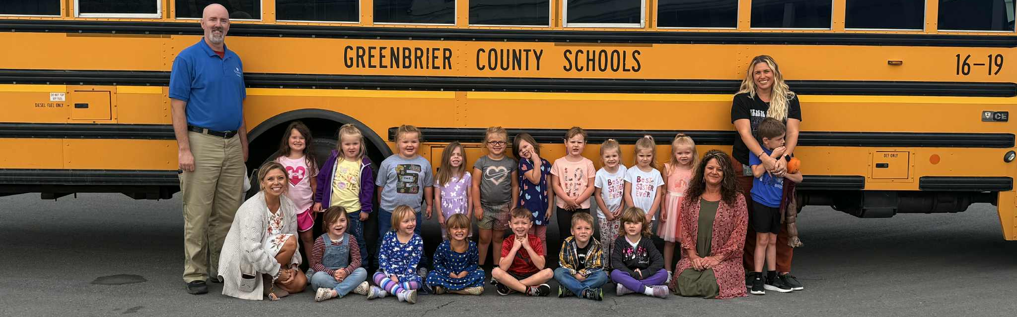 bus with driver and 17 little children 