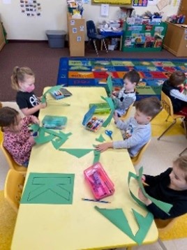 Students work on cutting in preschool