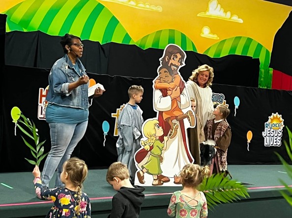 Preschool students in chapel learning about Palm Sunday