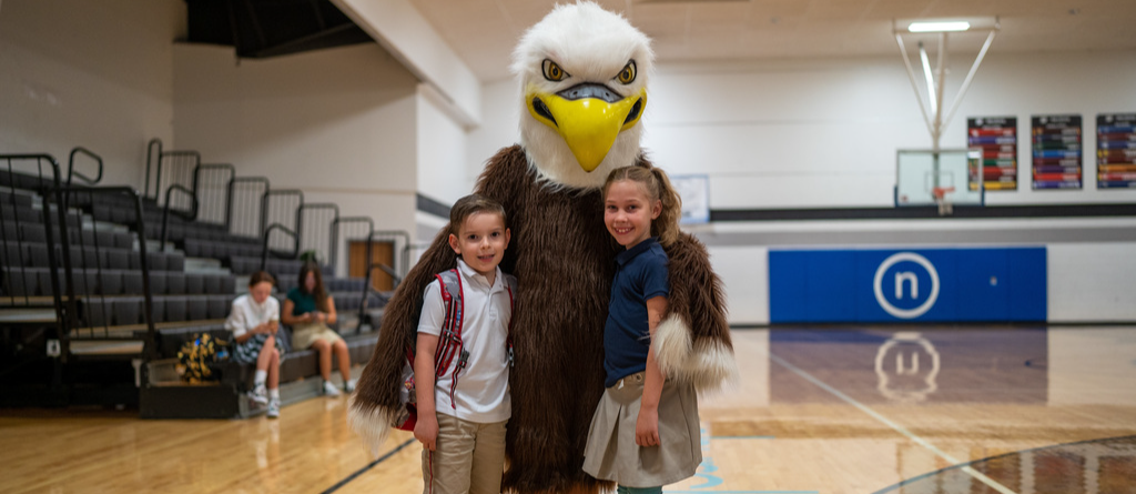 Bubba the Eagle mascot with elementary students