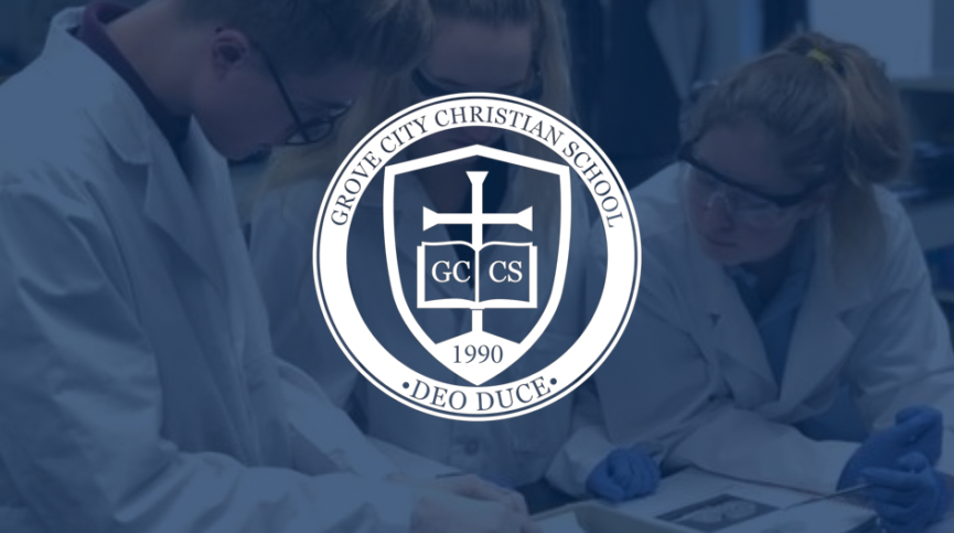 Image of GCCS logo of cross and bible inside of shield with text, "Grove City Christian School GCCS 1990 Deo Duce."