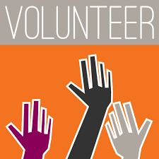 picture of three hands raised toward the word "volunteer"