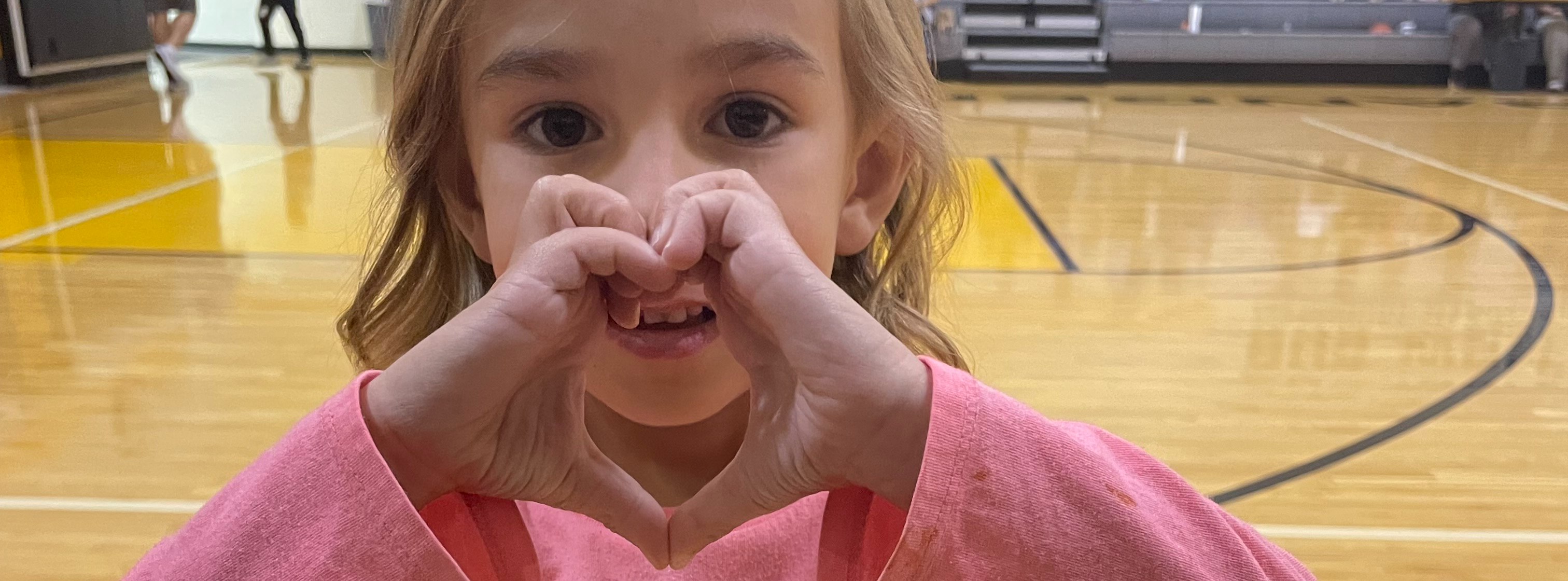 Student making a heart