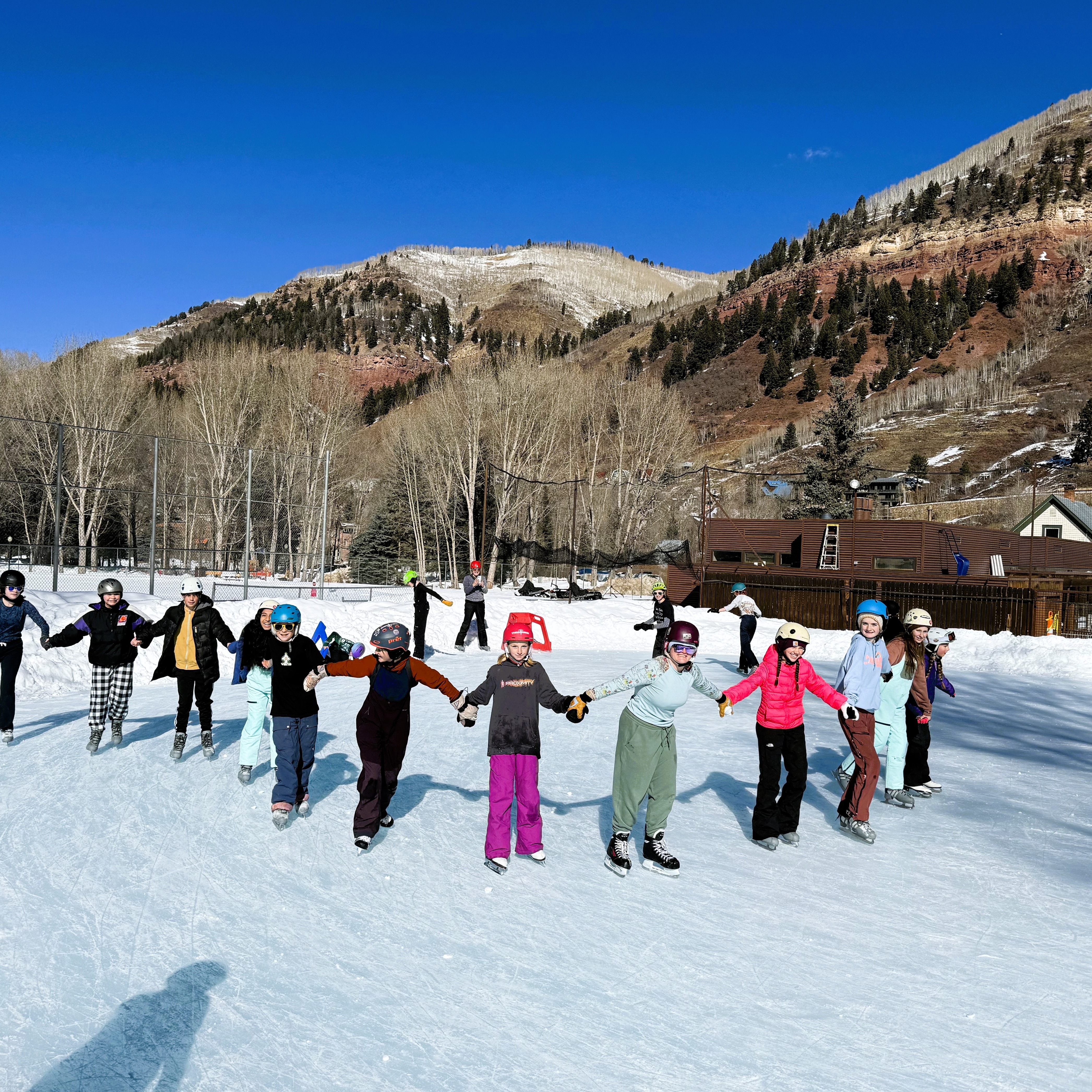 Middle school students ice skating at Telluride Town Park