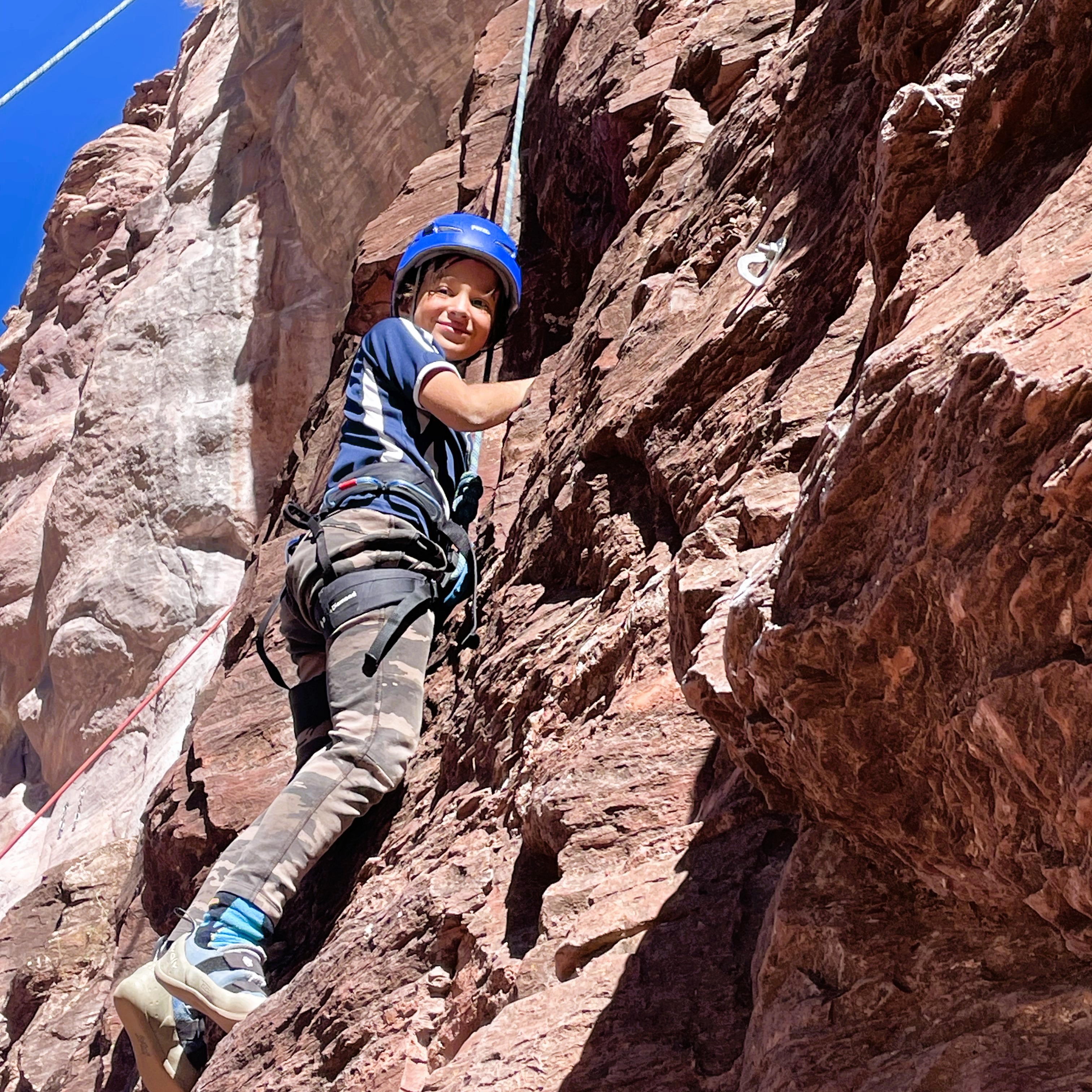 3rd grade student rock climbing at Rotary Park