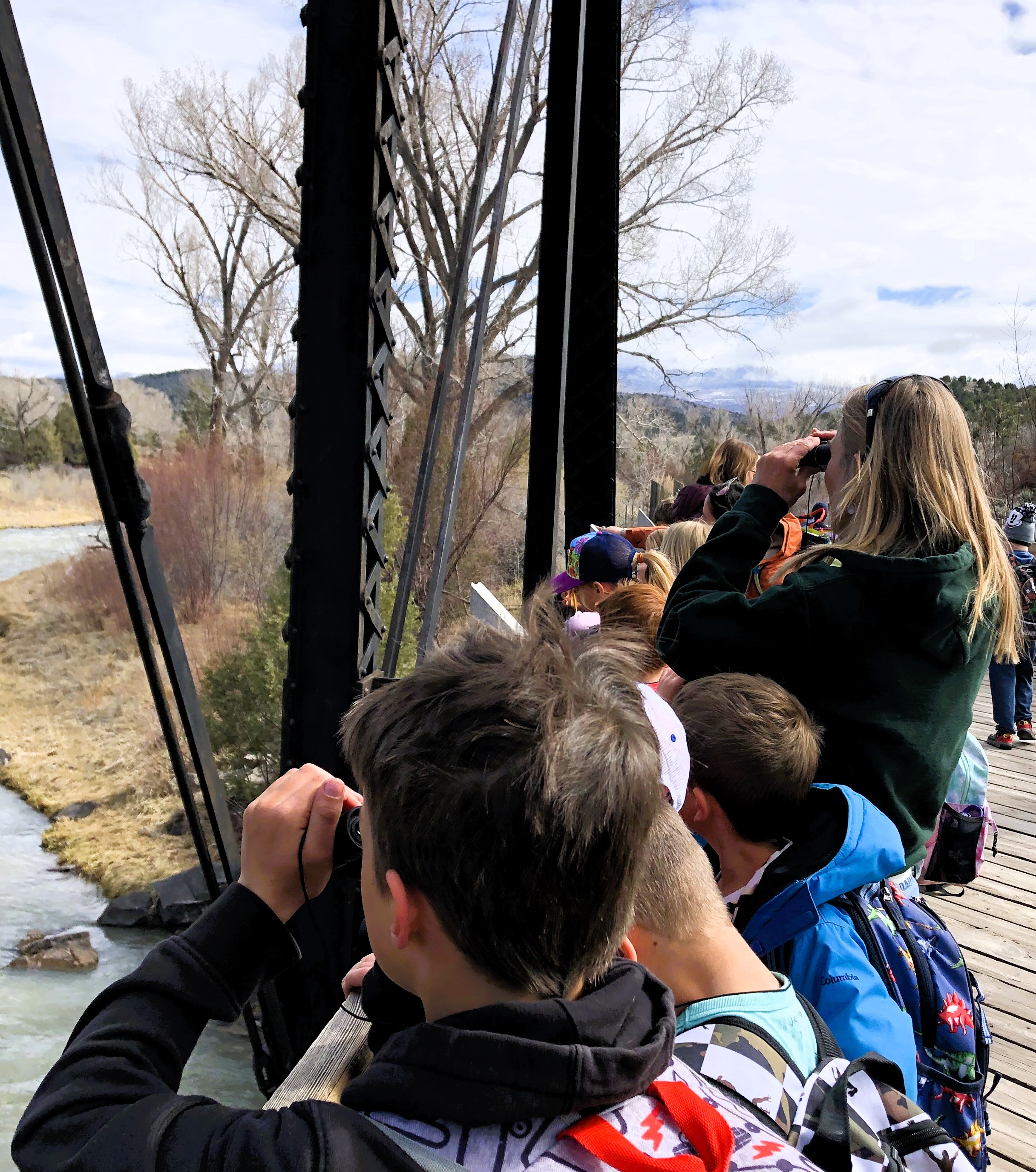 1st graders observing birds by the river