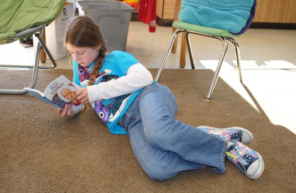 picture of a kid reading a book