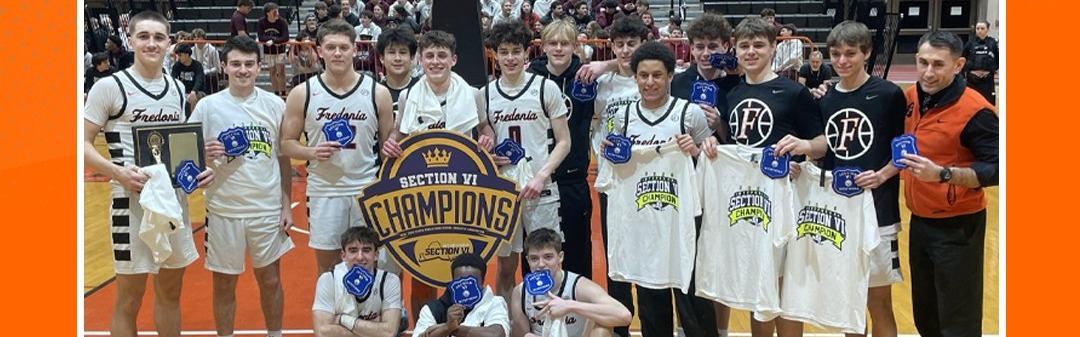 Varsity Boys Basketball team with their Section VI blue patches after winning the Class A2 championship.