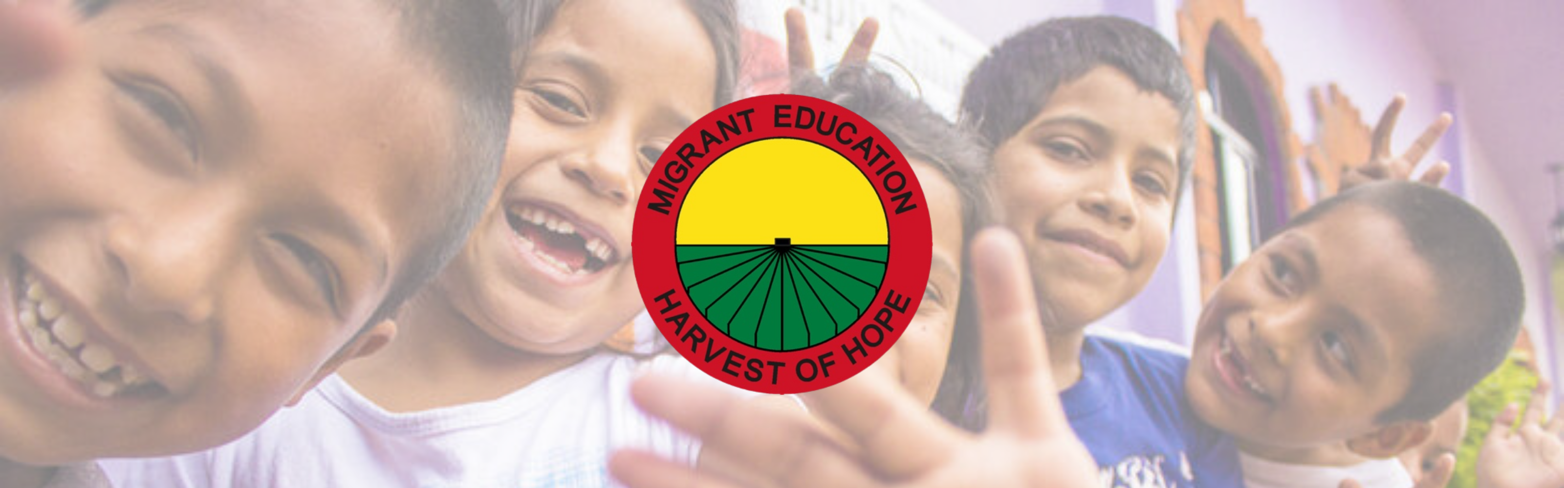 photo of students smiling at camera with migrant logo