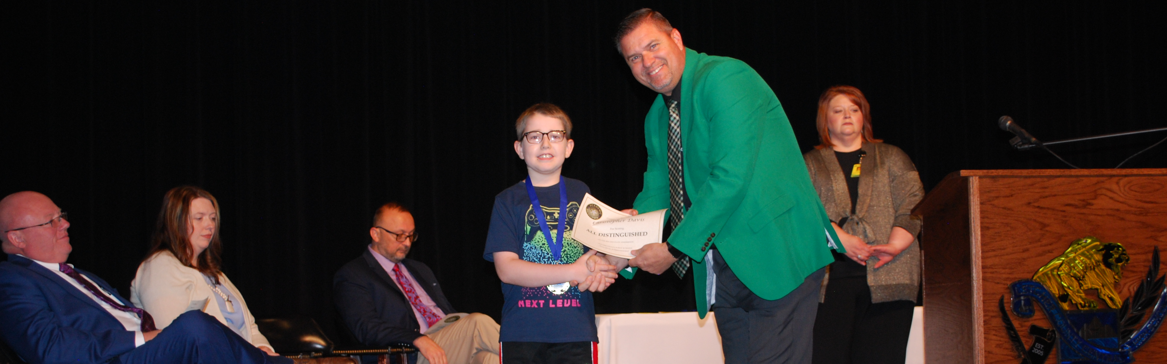 Arlie Boggs Elementary student receiving all distinguished test award.