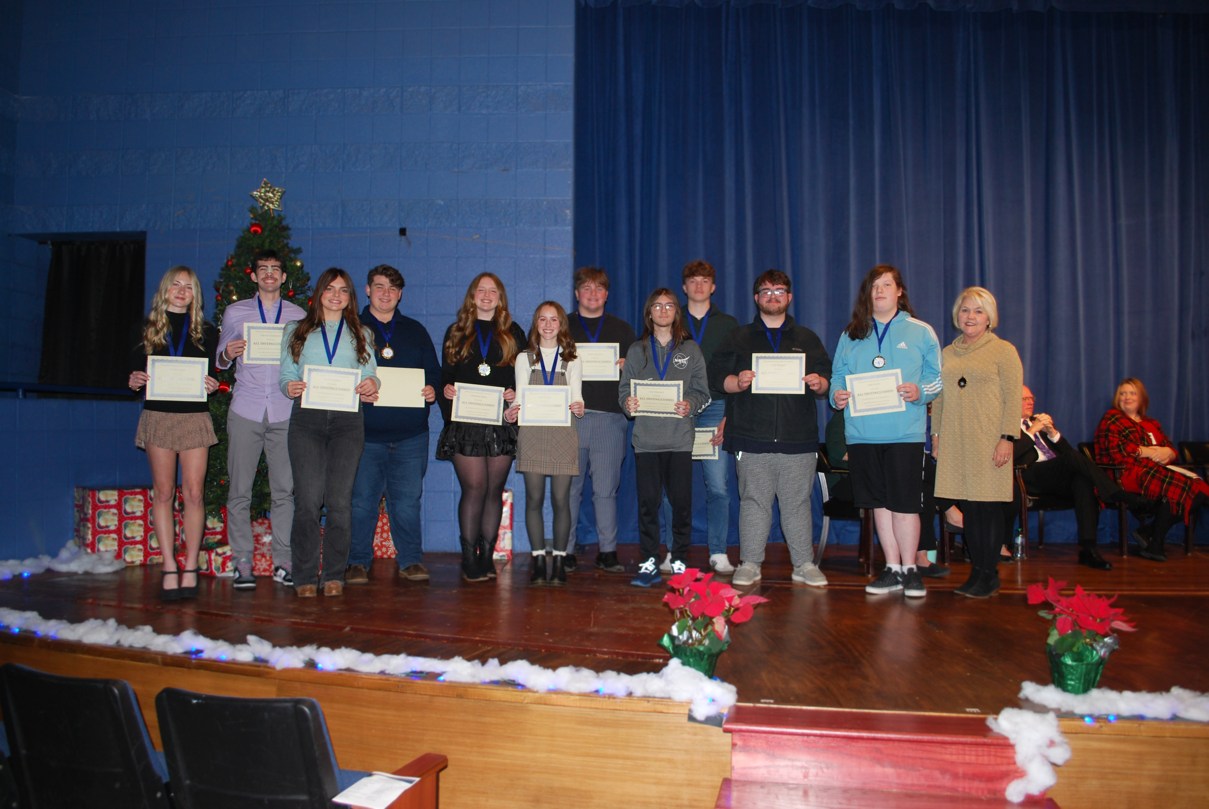 Letcher County Central students receiving certificate for scoring all distinguished on 23-24 Kentucky Assessment.