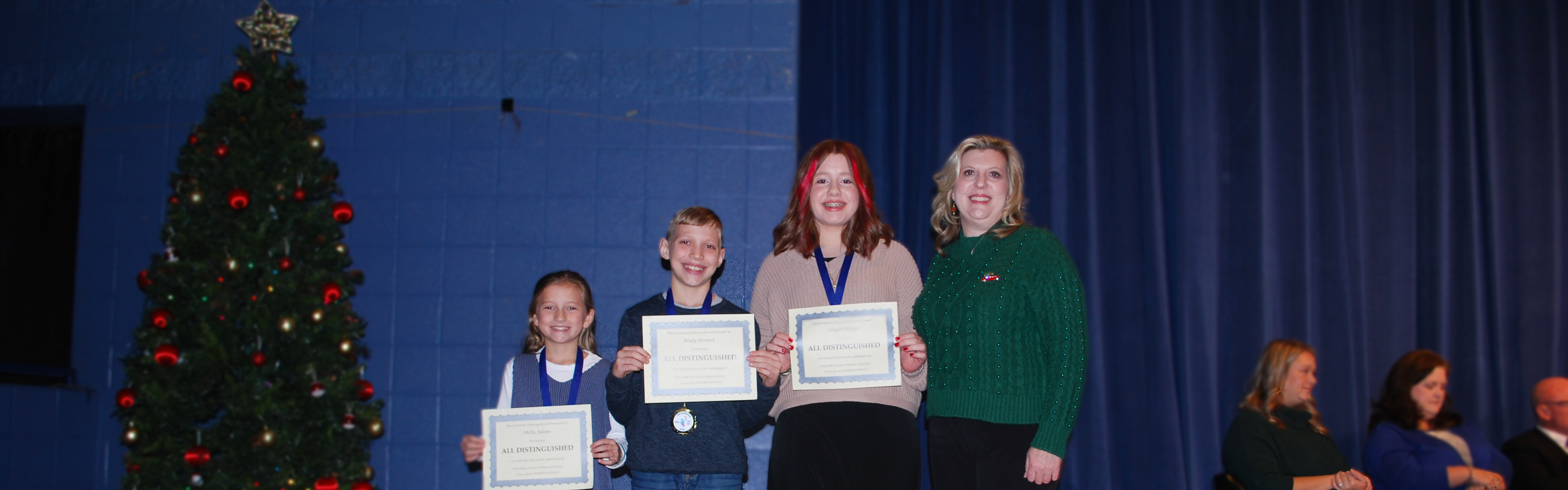 West Whitesburg students receiving certificate for scoring all distinguished on 23-24 Kentucky Assessment.