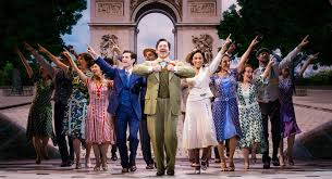 ppl at a town square man in green suit