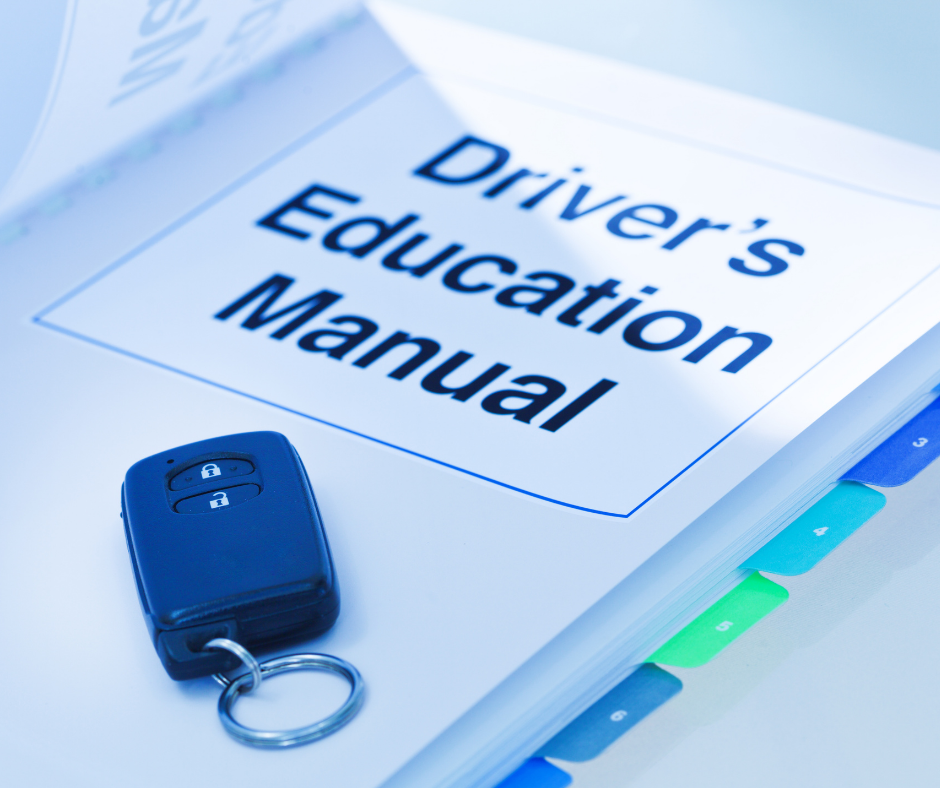 Drivers Education Manual with keys on top of it.