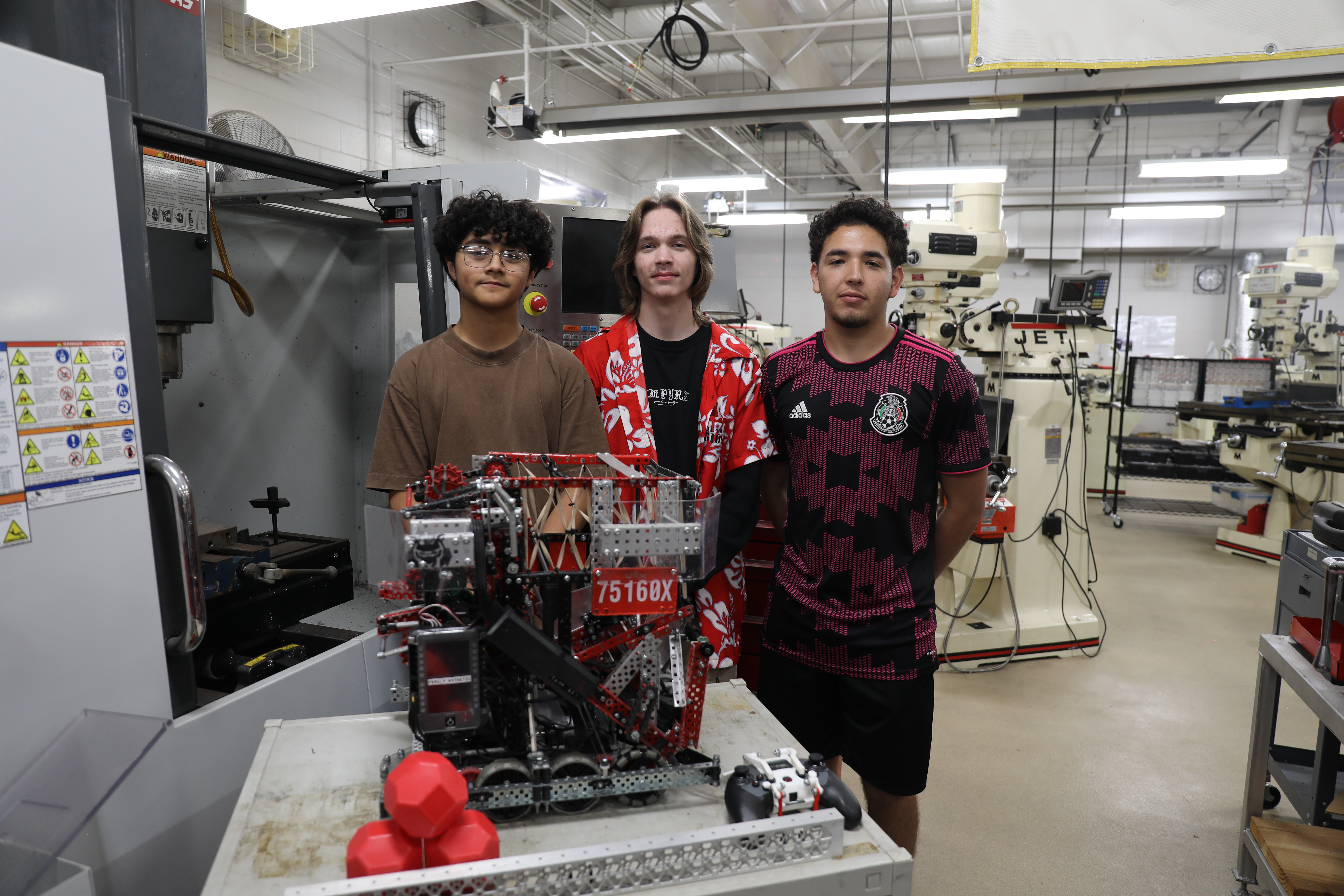 Ricardo Herrera, Nathan Clements, and Jesus Salazar - Terrell High School Robotics Team Posing for Photo for their News Story of them going to World Competition