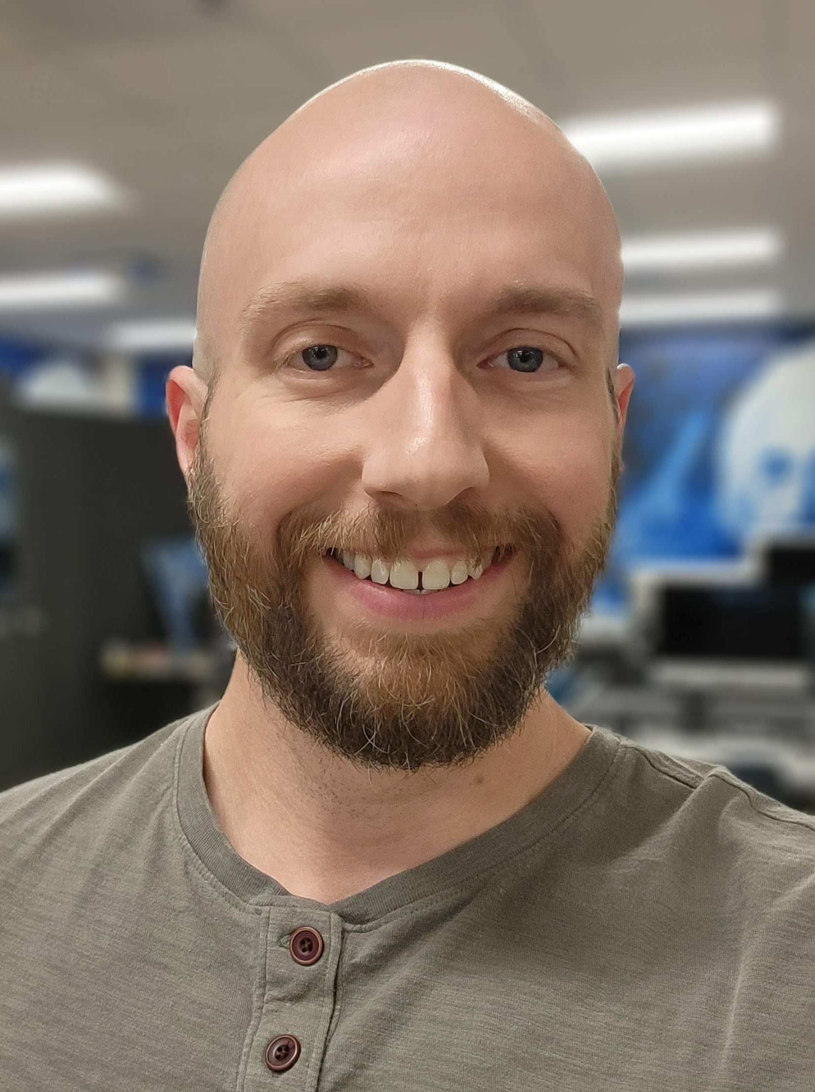 Image of man with beard and blue eyes smiling