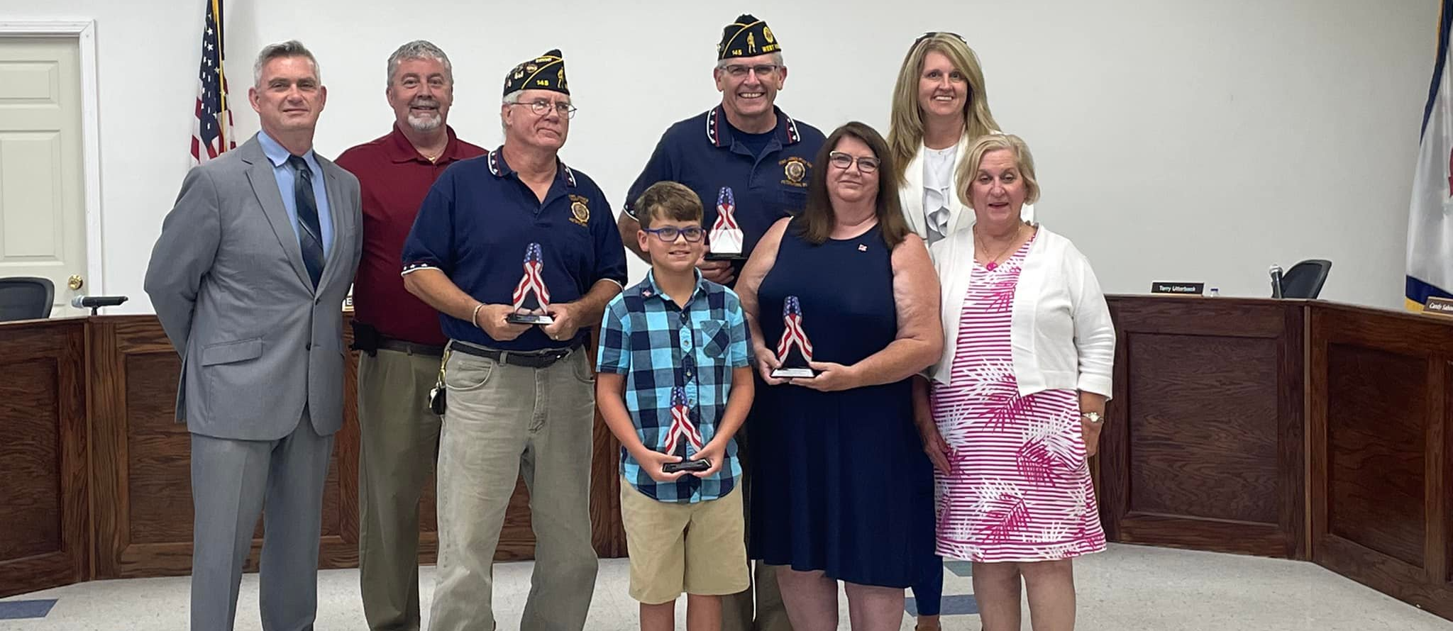 Board Members, student, teacher, and VFW with flag dedication for the new Peterstown PreK-8