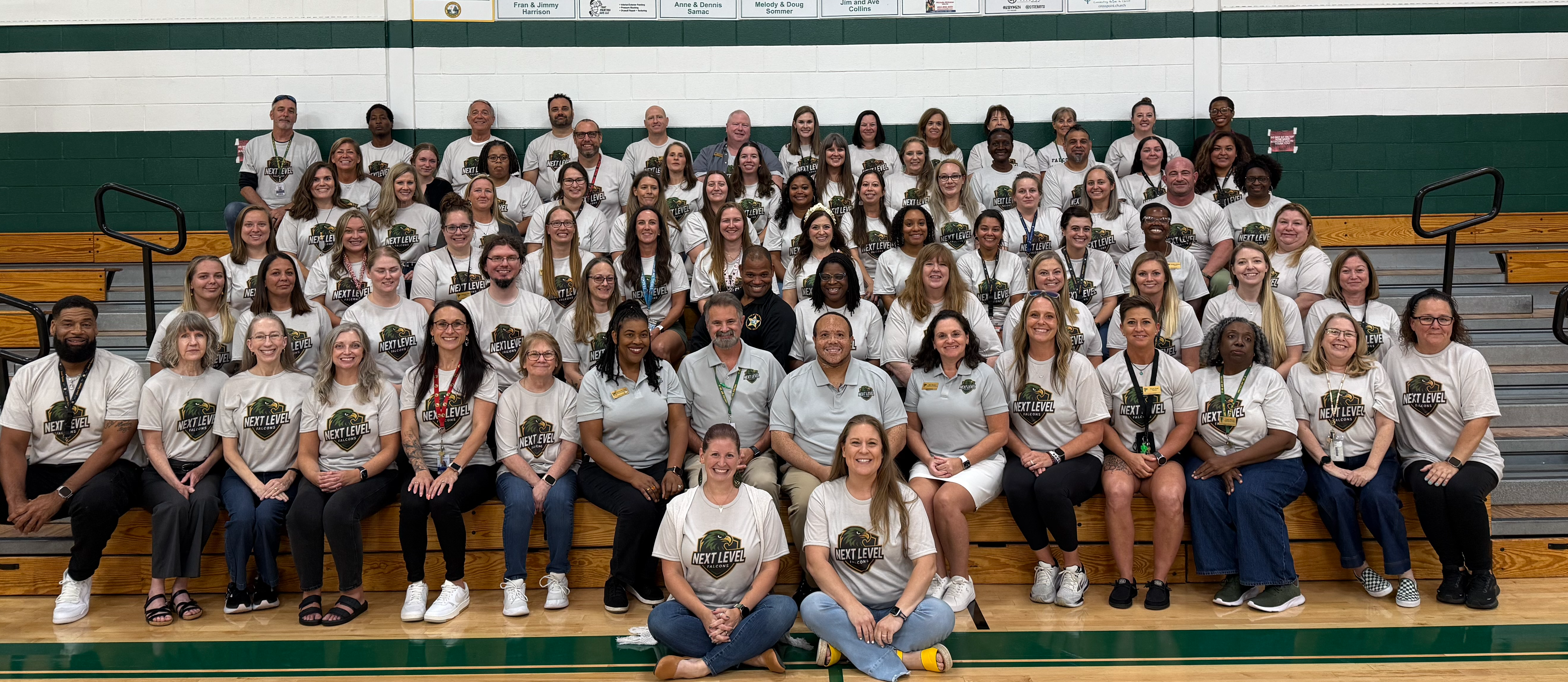 Lewis staff picture in the gym
