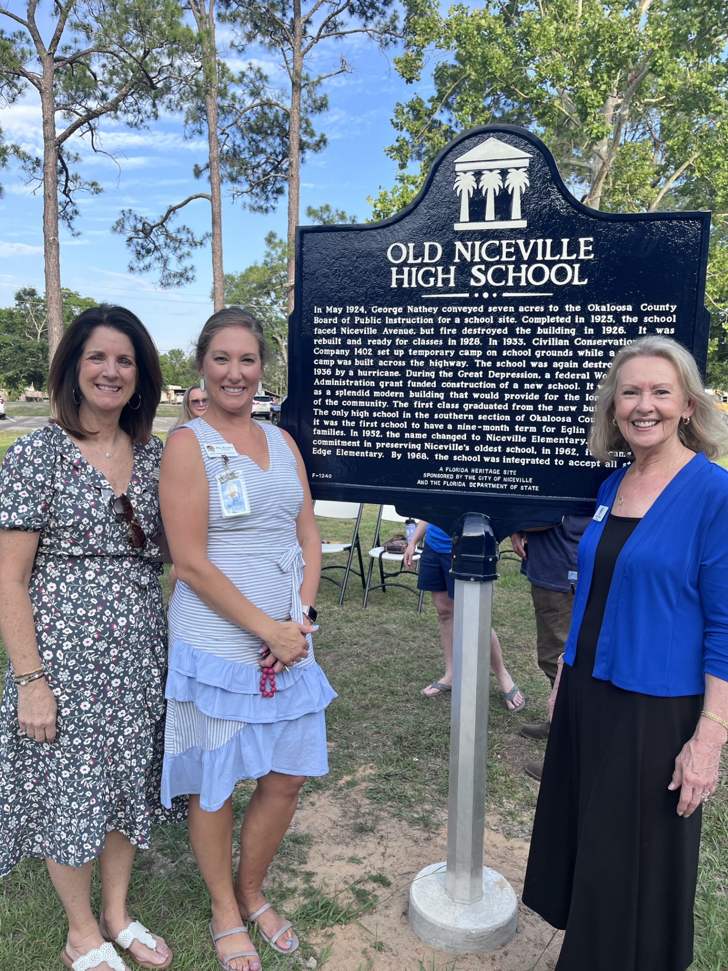 Mrs. Kearley and Mrs. Anderson in front of the Plaque