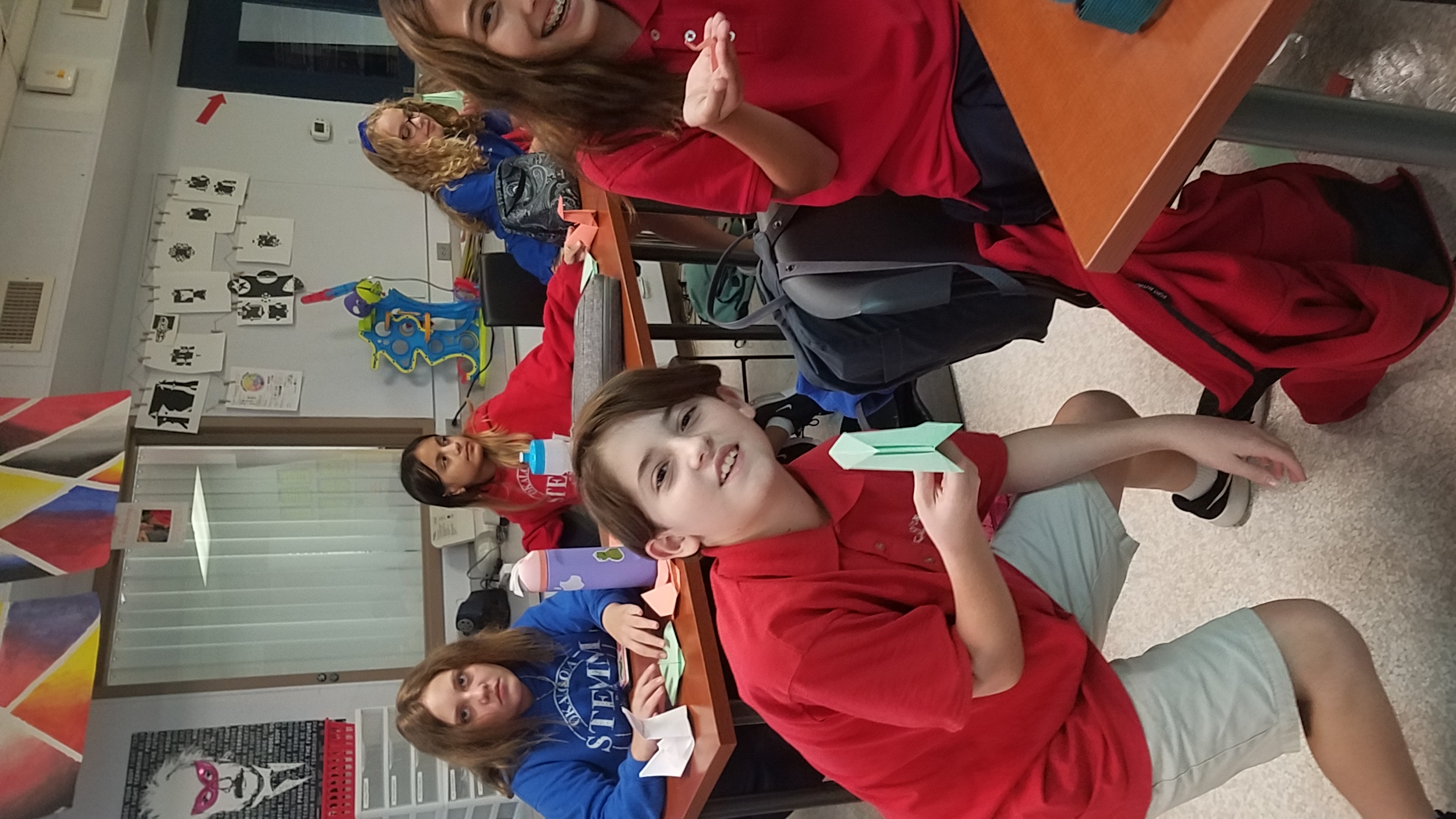 Art club members with origami swans