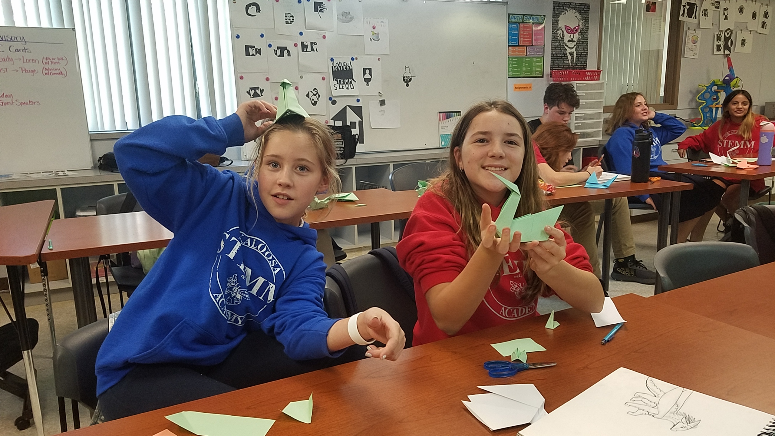 Art club members with origami swans
