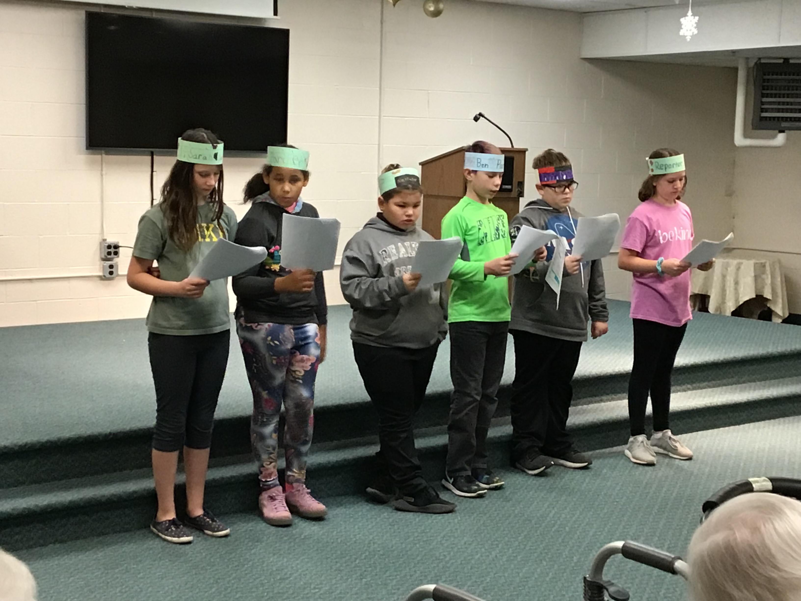 Students on Stage Reading a Play