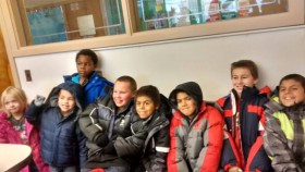 Students sitting together in warm coats
