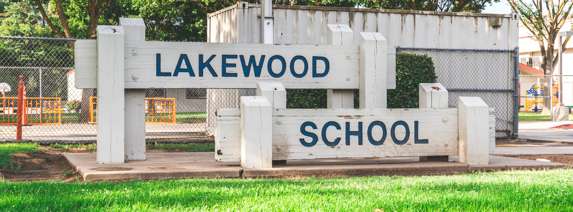 Lakewood School wooden sign in front of the school