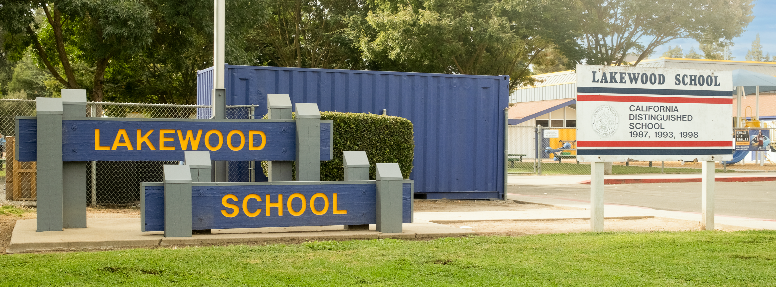 Lakewood School wooden sign in front of the school