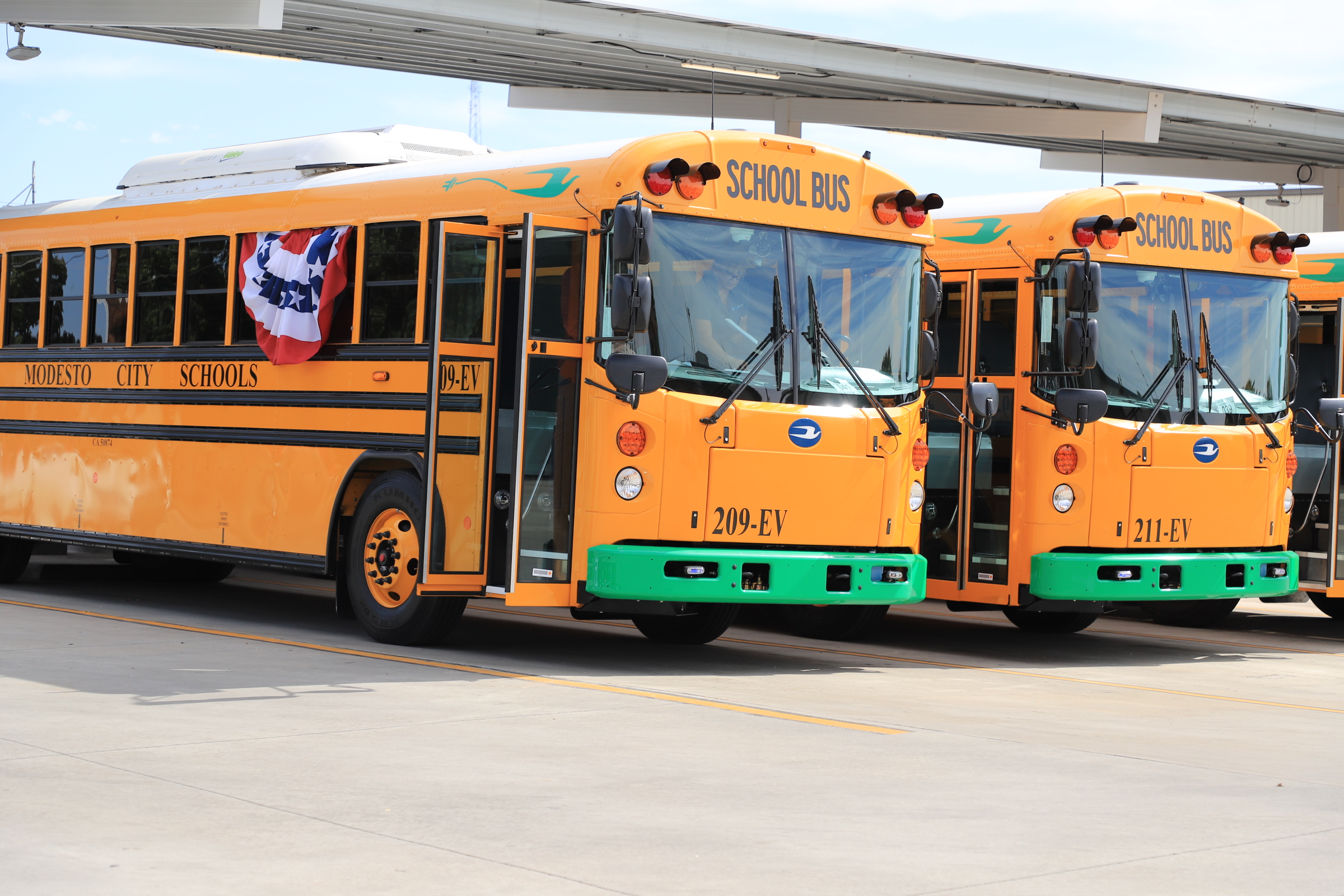 two buses transportation yard and modesto city schools