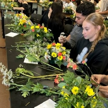 students working in flowers