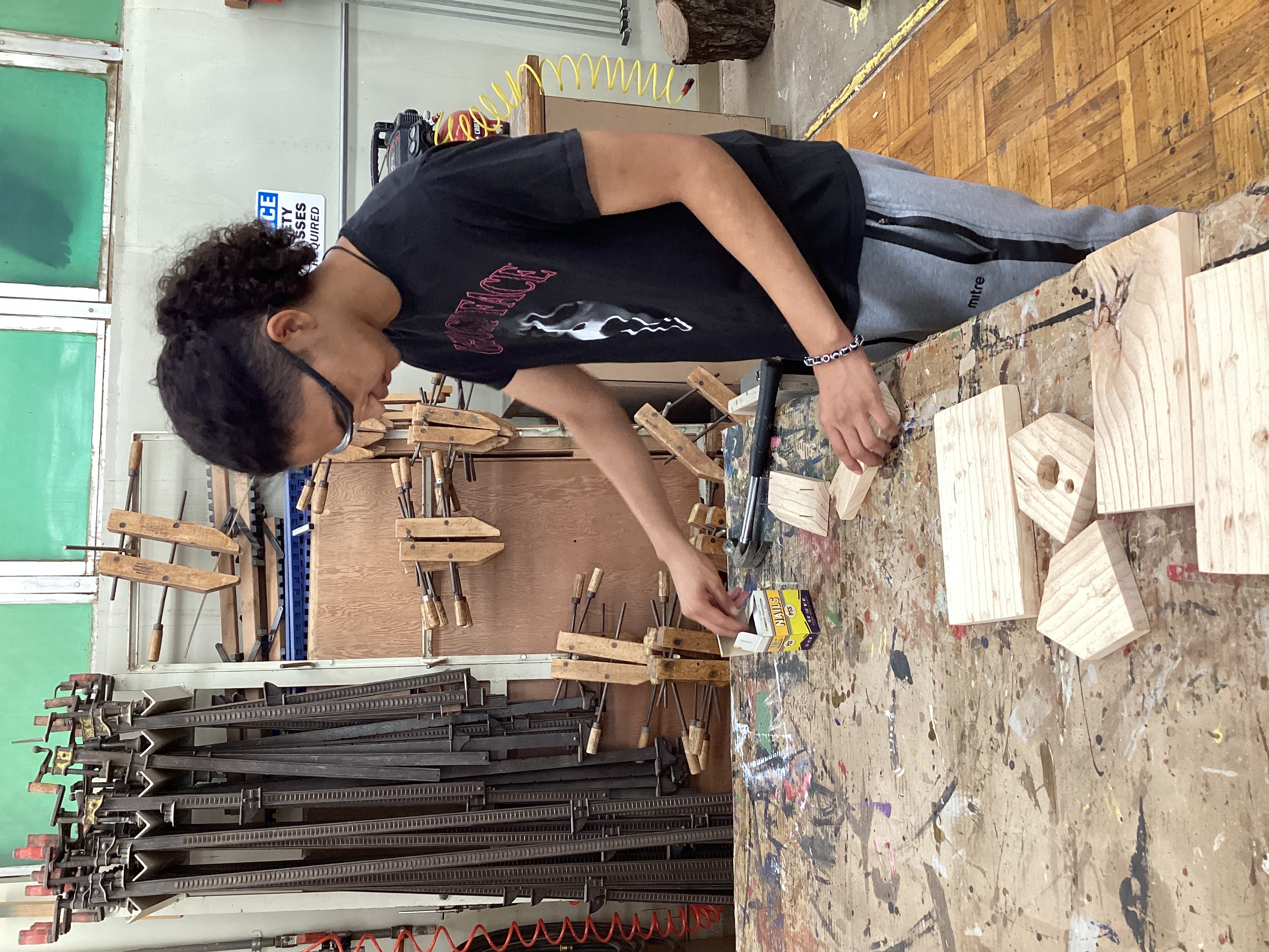 student working in shop