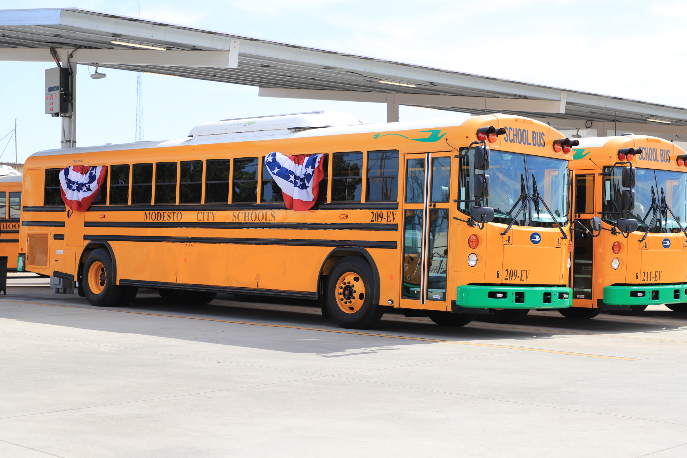 2 buses at the modesto city schools transportation yard