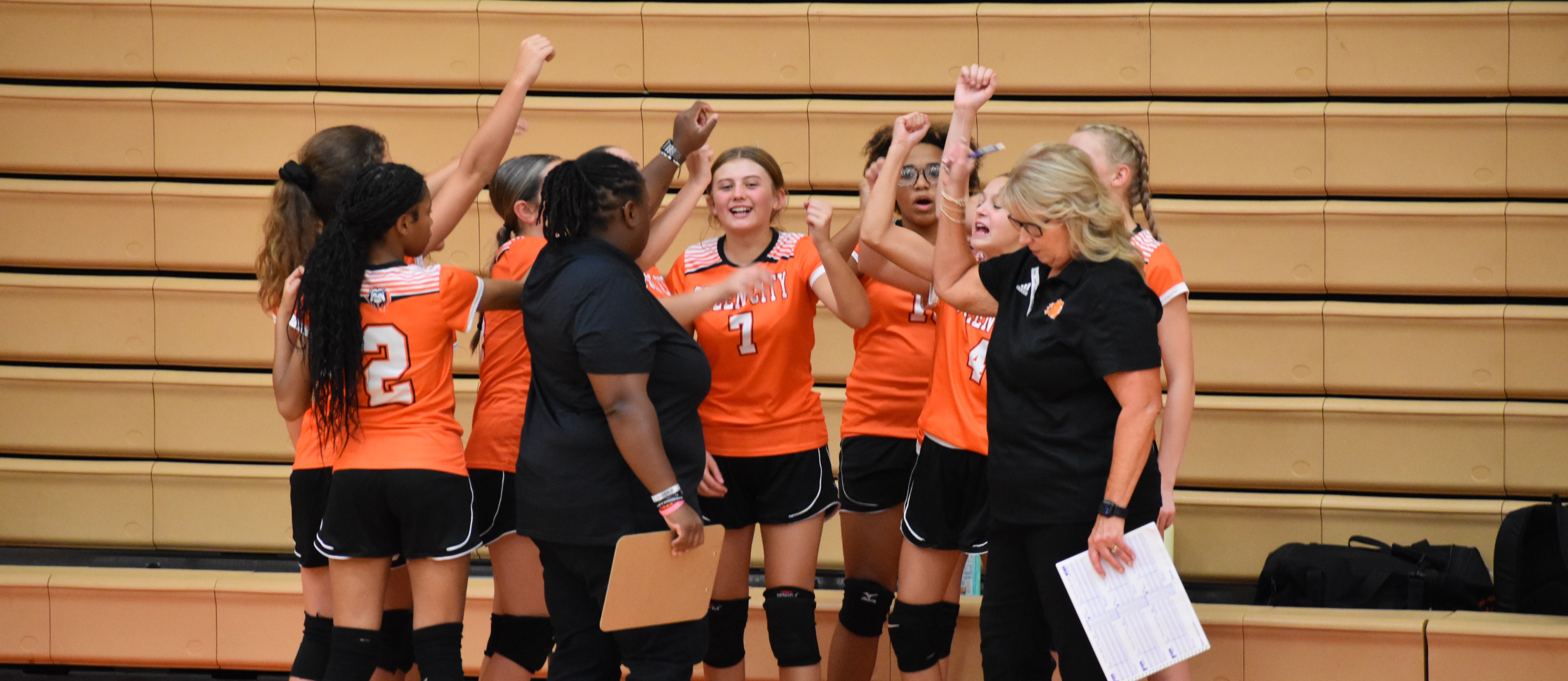 Volleyball girls in a team huddle