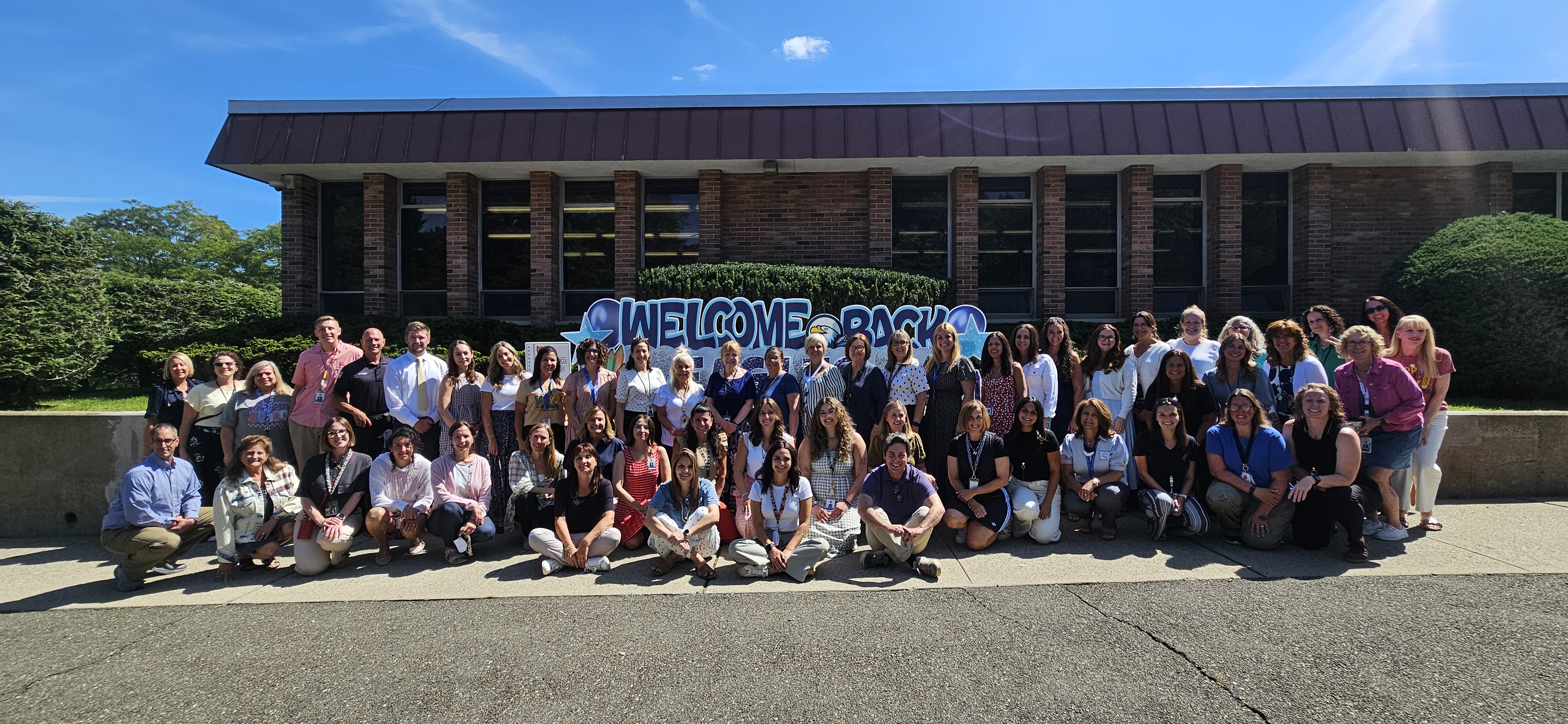 Sicomac Staff in front of the building