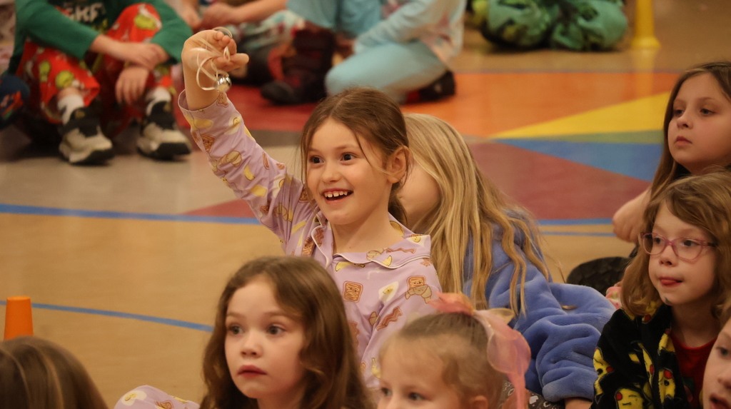 CES Student With Bell